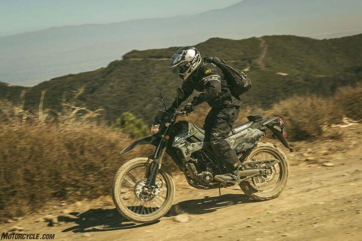 2018 kawasaki klx250 first ride review, A seat strap under a rider s butt is my only ergonomic complaint about the reborn KLX250 A small bag atop the rear fender provides stowage for tools while a helmet lock is provided a few inches below