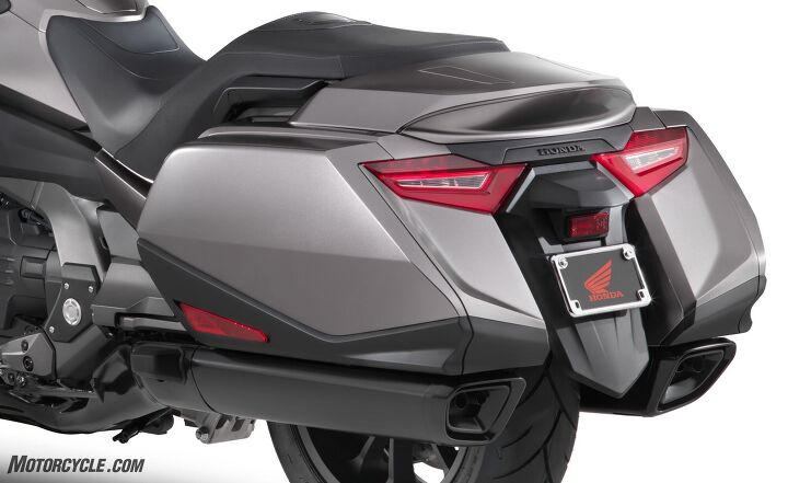 first look 2018 honda gold wing and gold wing tour, The mufflers are more of a part of the Gold Wing s style in 2018 and they sound great too The standard Gold Wing gets blacked out components while the Gold Wing Tour gets more chrome