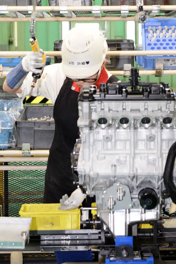 suzuki factory tour part 2 takatsuka engine manufacturing plant, Another GSX R1000 engine is nearly complete Note the white gloves used by all factory workers that ensure cleanliness and to remove the risk of contamination of sensitive parts