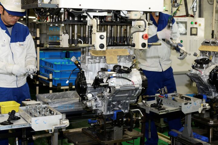 suzuki factory tour part 2 takatsuka engine manufacturing plant, Once the cylinder head is placed onto the engine block a computerized machine applies torque to all head bolts simultaneously to mitigate any warping as the two surfaces mate with each other