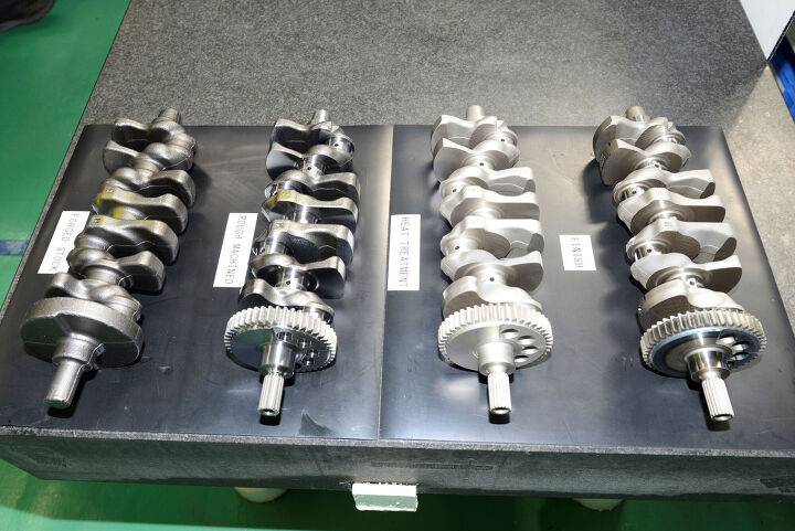 suzuki factory tour part 2 takatsuka engine manufacturing plant, The GSX R1000 s forged steel crankshafts arrive in rough condition as seen on the far left Basic machining at Suzuki is the next step which includes the cutting of gear teeth and bearing surfaces Then the entire crank is heat treated before the final machining and finishing touches are applied Seen on the right is the production ready piece ready for installation in its engine block