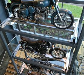 royal enfield s uk technology center tour, Entry into the Technology Center displays a snapshot of Royal Enfield s rich history A vertical stack of the company s most significant models that date back to the 1930s all the way up to its most current offerings are proudly displayed in the building s foyer As soon as we climbed the stairs and looked behind the curtains we found all the latest cutting edge technology needed to develop and engineer modern motorcycles