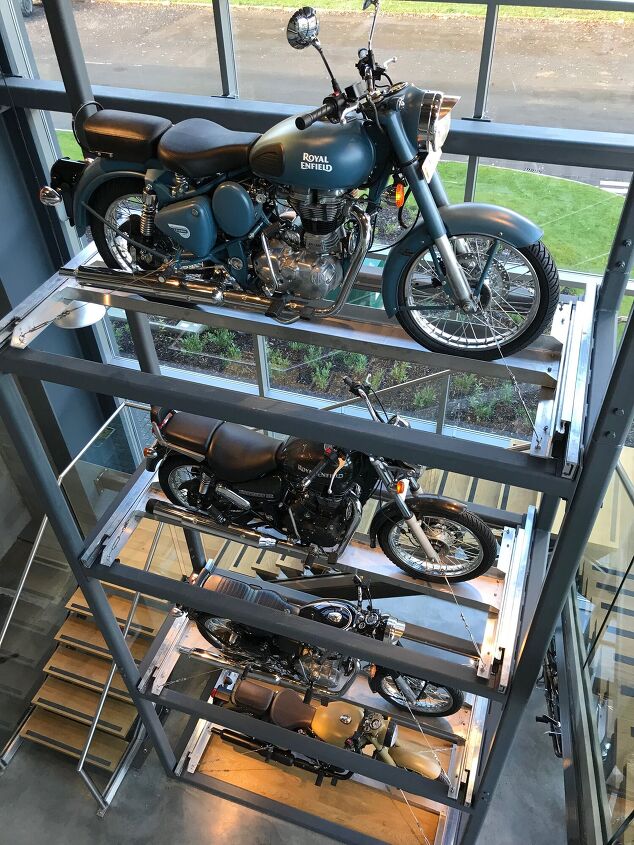 royal enfield s uk technology center tour, Entry into the Technology Center displays a snapshot of Royal Enfield s rich history A vertical stack of the company s most significant models that date back to the 1930s all the way up to its most current offerings are proudly displayed in the building s foyer As soon as we climbed the stairs and looked behind the curtains we found all the latest cutting edge technology needed to develop and engineer modern motorcycles