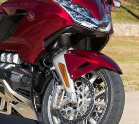2018 honda gold wing tour review, Look closely and you ll see how tightly placed the front wheel is to the engine That s because the double wishbone fork tracks straight up and down over bumps
