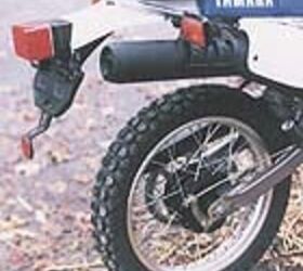 church of mo 1998 yamaha xt350, Gracing the rear fender is a little pouch containing the Yamaha tool kit You could fit a kit of your own inside as long as it was the size of a Kit Kat Anything else would probably be too big to fit