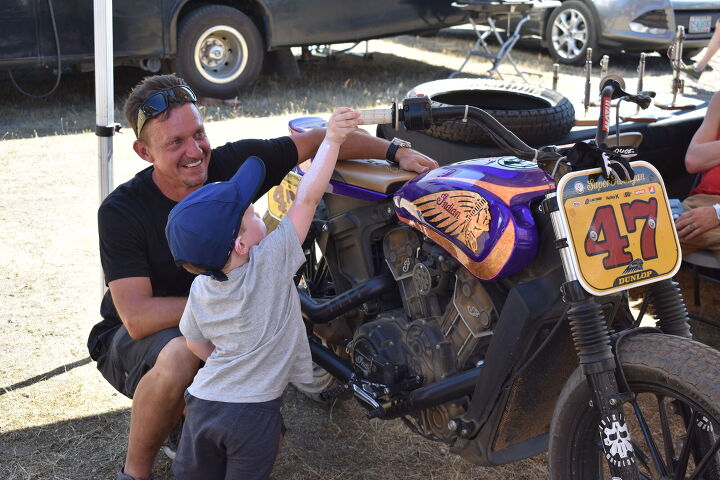 the wild one the holy grail of flat track fun, After it was back to the pits and we had all sorts of visitors interested in checking out the bikes Here s Andy again with one of our youngest fans revving up the motor on Jordan s race bike