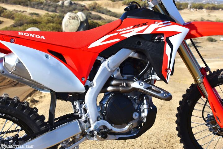 2019 honda crf450rx first ride review, Thanks to the elimination of the kick starter the 2019 CRF450RX now features larger diameter and longer exhaust pipes which translate to improved throttle response and more power across the entire powerband especially on the top end Additionally the new design allows for shorter mufflers and a lower and more concentrated center of gravity for improved handling Besides who doesn t like the look of dual pipes