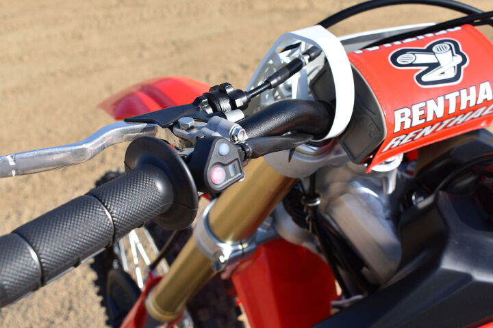 2019 honda crf450rx first ride review, Those two buttons right there control your HRC Launch Control on top and your EFI mapping and ignition timing on the bottom They re both intuitive easy to use and can be adjusted on the fly