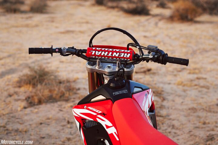 2019 honda crf450x review first ride, Missing from this picture that I hoped we d see is an adjustable top triple clamp But otherwise the 19 450X has really nice ergos and a clean cockpit that will comfortably suit a wide variety of riders This new X also has a 2 01 gallon titanium fuel tank and larger capacity radiators A neat feature about the fuel system is that it measures the amount of gas consumed rather than what s left This makes it easy if you were to ever put a larger tank on there