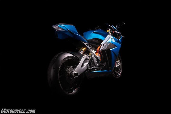 no more teasers the lightning strike is finally here, The rear view of the Strike reveals more of its slim aerodynamic profile Also visible in this Carbon Edition are the carbon body panels Pirelli Supercorsa tires hlins suspension Brembo brakes and coolant lines running into the motor