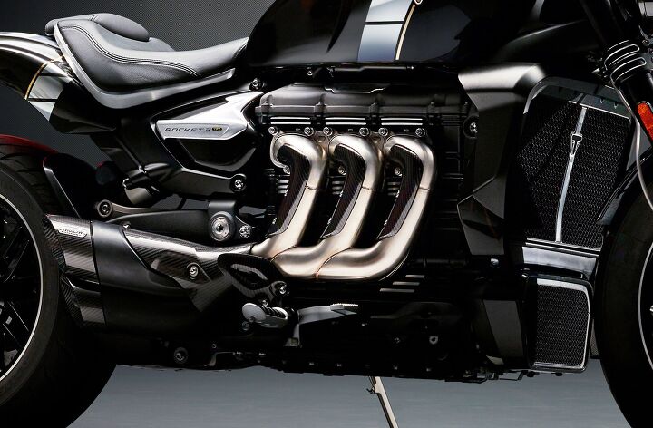 2019 triumph rocket 3 tfc revealed with ginormous 2500cc triple, Each of the Rocket 3 TFC s cylinders has a larger displacement than the Tiger 800 s three cylinders combined Carbon shielded pipes exit from each cylinder leading toward two stacked Arrow silencers with carbon fiber end caps