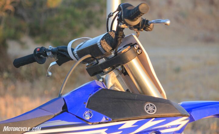 2019 yamaha yz250fx review, The Yamaha YZ250FX s adjustable handlebar and riser setup allows four positions for riders to choose from Also of note is the magic black button on the right Thank the moto gods for E start An accessory kickstarter is available if you re into that sort of thing