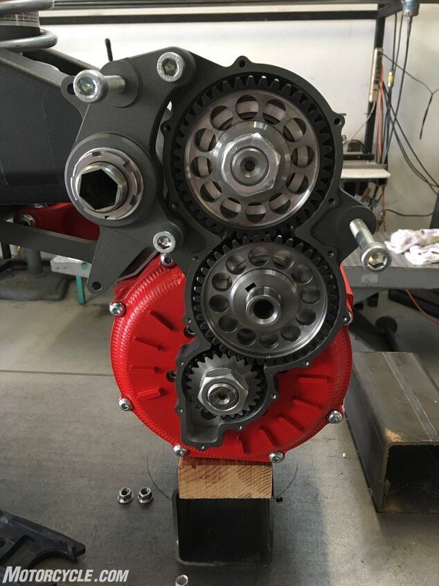 riding and racing the lightfighter lfr19 electric motorcycle part 1, A closer look at the motor and the gear reduction set You can t see it in this photo but behind the uppermost gear a jackshaft runs across to the countershaft sprocket