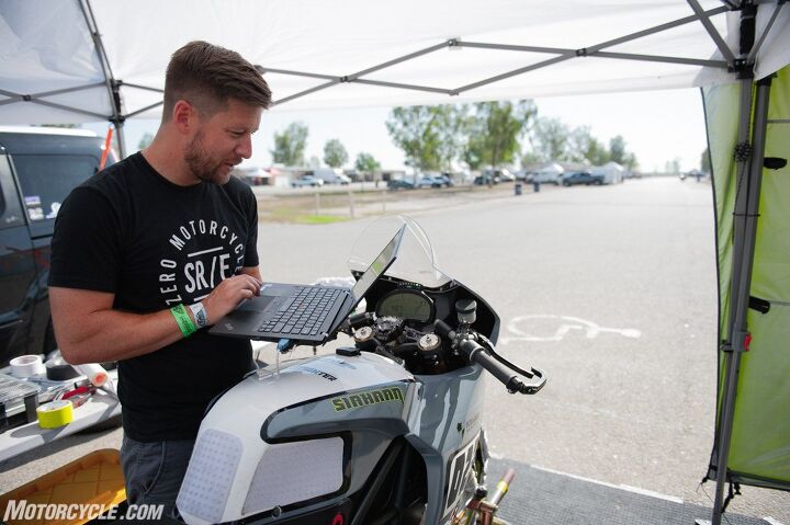 riding and racing the lightfighter lfr19 electric motorcycle part 2, Wismann hard at work analyzing data and making tweaks to extract as much performance as possible all with a few keyboard strokes