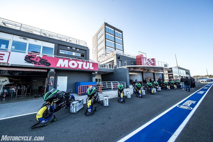 testing a motoe racer the energica ego corsa, Less than 24 hours earlier these nine Ego Corsas took part in the MotoE season finale at Valencia Now journo hacks like me would get their turn on one using the same MotoGP spec Michelin tires Note the Enel power banks providing power for the tire warmers
