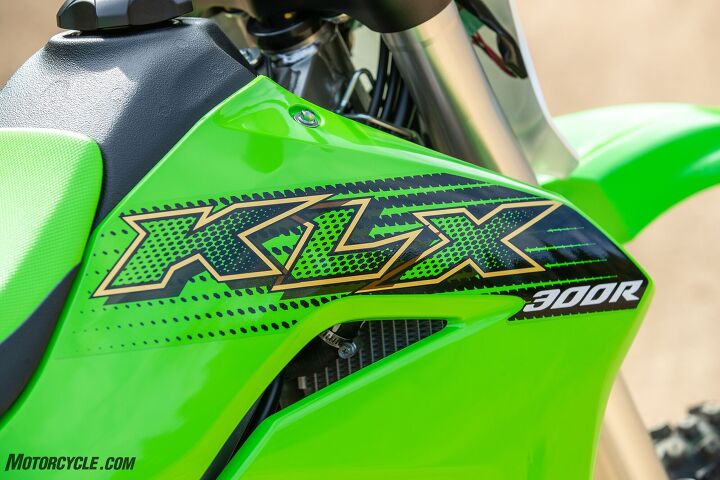 2020 kawasaki klx300r review, The 2 1 gallon tank sits pretty high in the frame and limits how far forward one can scoot up to get weight over the front tire