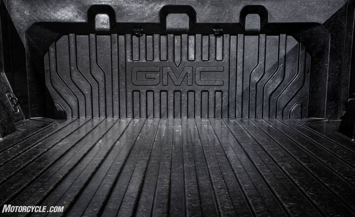 a week with gmc s sierra denali carbonpro, Durability and malleability were key factors in GMC s decision to make a carbon fiber reinforced polymer truck bed The carbon fiber used in the CarbonPro bed is actually one inch strips of the material mixed into a polymer that allows GMC to easily mold features such as the wheel chock indentions into the bed while also allowing scrap material to be shredded melted down and reused for other reinforcement components Photo courtesy of GMC