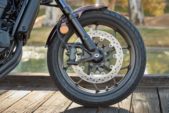 2021 honda rebel 1100 dct first ride review, The front brake on our bike is a bit on the spongy side but still stops the cruiser plenty hard A nice steel brake line would be a good upgrade The rear disc s at least easy to use even with the cruiser ergos and highly effective