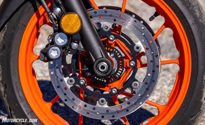 2021 yamaha mt 07 review, Bigger round brake discs replace the smaller petal type discs for improved stopping power Note the standard ABS ring in the center