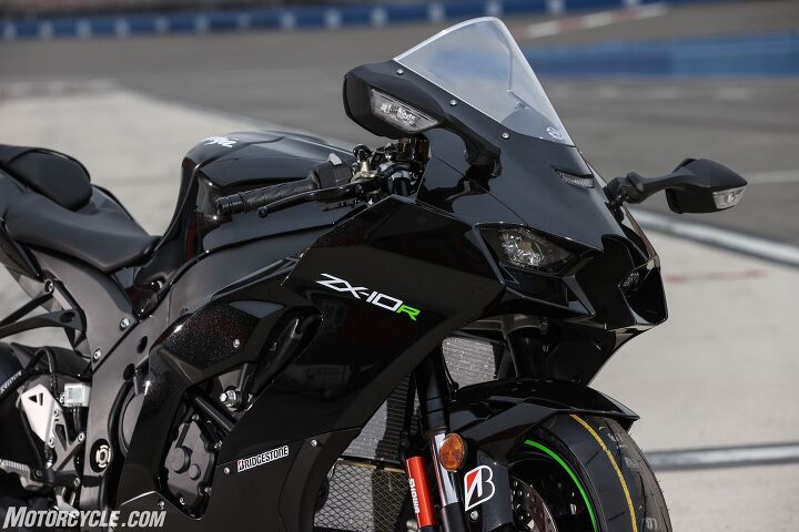 2021 kawasaki zx 10r review first ride, One of the visible changes behind the fairings is the addition of an independent oil cooler seen here underneath the primary radiator The redesigned fairing helps draw air towards it