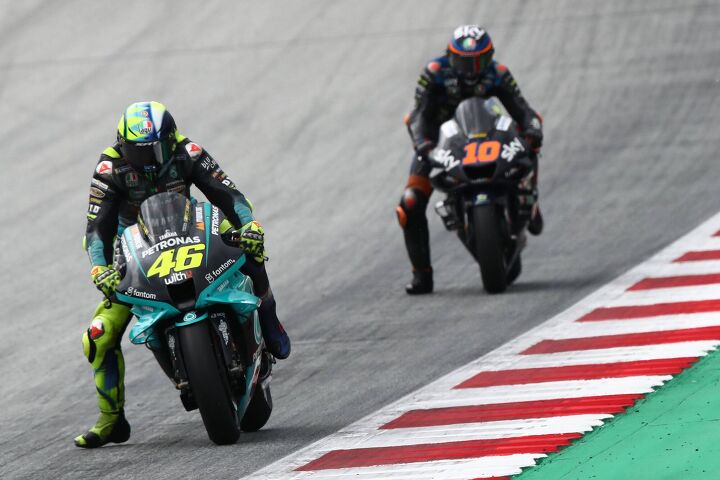 ask mo anything what s the point of the leg dangle, This guy started it If you don t know that s Valentino Rossi in front showing his kid brother Luca Marini how the leg dangle is done Photo Petronas SRT