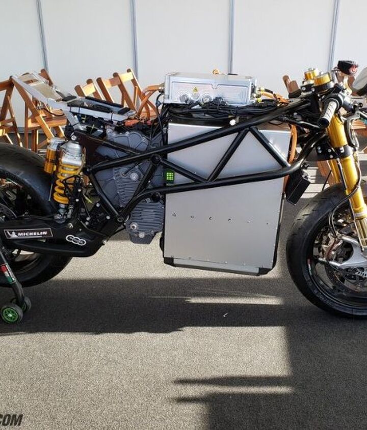 ducati motoe prototype electric racebike makes public testing debut, This is a 2019 Energica Ego Corsa MotoE racer sans bodywork If your eyes are anything like mine you were instantly drawn to the huge battery Look past it and you ll see the Rinehart controller on top of the battery an oil cooler in front and a green LED on the rear edge of the battery Its job is to alert the bike s status to anyone who may come in contact with the machine Green means safe red means danger say in the event of a crash and there s terminal damage Ducati s challenge will be to minimize the size and weight of the battery and motor while still maintaining speed and performance throughout the race