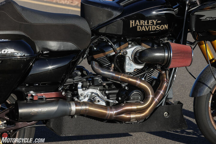 king of the baggers riding the harley davidson screamin eagle factory road glide, Harley s 131ci crate engine is at the heart of this beast Here you can see the custom air intake exhaust and carbon fiber belly pan