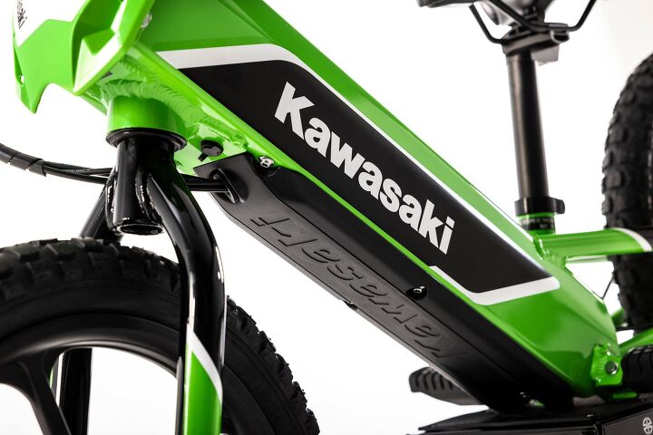 2023 kawasaki elektrode first look, That small black circle in front of the battery is the cover for the charging port The battery can get a full charge in 2 5 hours thorugh a regular household power outlet