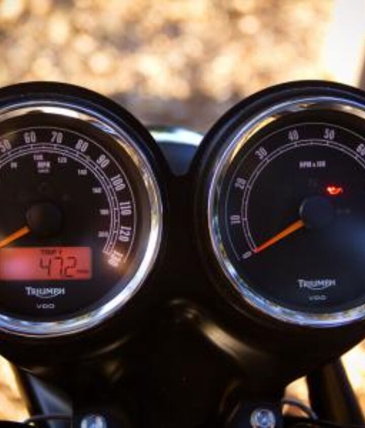 church of mo 2012 triumph scrambler review, The Scrambler is fitted with dual gauges framed by chrome bezels The LCD odo clock is a giveaway they re not vintage Smiths