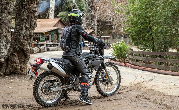 2023 kawasaki klx230 s review first ride, For this 5 4 rider the lowered seat height lends just enough room to touch ground on both sides