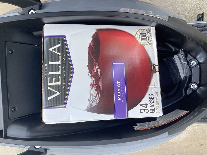 2022 sym fiddle iv scooter review first ride, A box of delicious Vella Merlot measures 9 x 11 5 x 3 75 inches There s a really handy hook that pops out from the front apron to carry a bag or two or your purse and the wraparound grab bar gives plenty of bungee net attachment points for lugging bigger objects around There s also a SHAD designed color matched top box available for 199