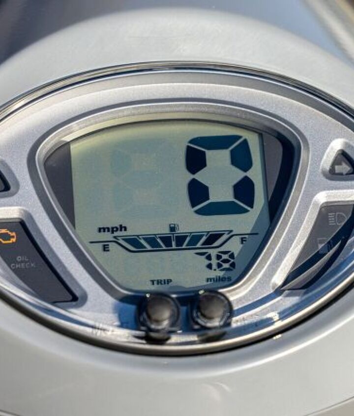 2022 sym fiddle iv scooter review first ride, Actually the instrument housing is kind of retro but the LCD instrument itself really is more 90s cheap watch At least the big speedo numbers are easy to read and there s also a gas gauge odometer tripmeter and a clock There s a USB port right down there on the left too