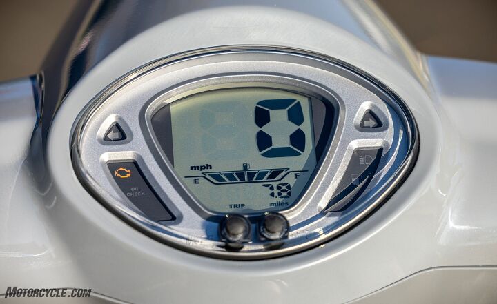 2022 sym fiddle iv scooter review first ride, Actually the instrument housing is kind of retro but the LCD instrument itself really is more 90s cheap watch At least the big speedo numbers are easy to read and there s also a gas gauge odometer tripmeter and a clock There s a USB port right down there on the left too