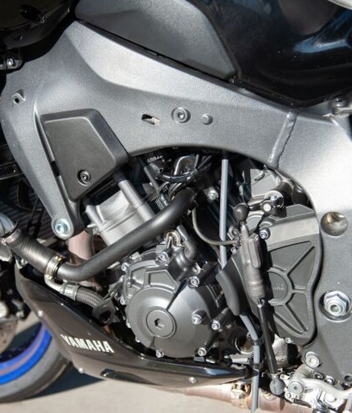 yamaha mt 10 sp project bike update 1, On previous versions of the FZ MT 10 the ECU lived on the left frame spar making it very easy to get to Starting with the 2022 revamp a plastic cover hides an ugly hole in the frame and the ECU is moved under the seat as shown in the photo above