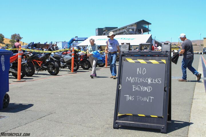 2021 international motorcycle show at sonoma raceway, Attendance was light both times the author visited the event The ironically titled sign is at the halfway point of the motorcycle parking which was less than 1 4th full on Sunday morning Photo by Alan Lapp