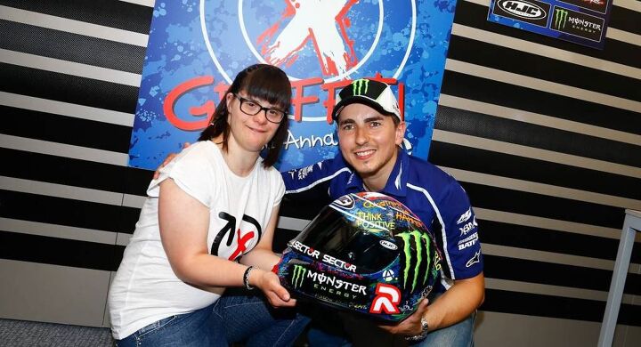 hjc launches new helmets for 2014, Anna Vives is a symbol that people with Down syndrome are capable of a lot more than some people think said Lorenzo post race I was very proud and happy to have her on the podium to share the win with me