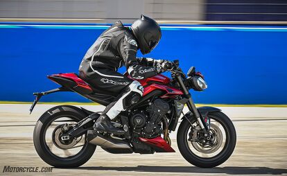 2024 triumph street triple 765 r rs review first ride, Accelerating down Jerez front straight highlights the top end power of the RS Once above 120 mph the lack of wind protection becomes a battle and the tight confines of the seat prevent scooting back into a proper tuck