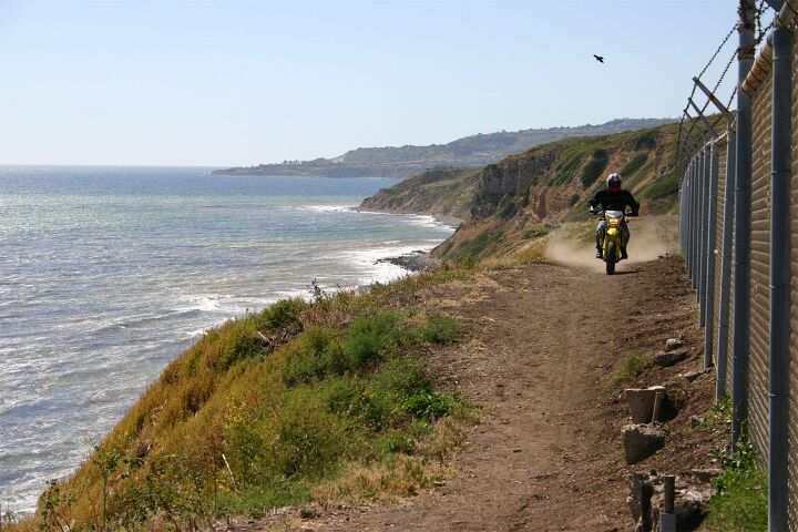 church of mo 2005 suzuki drz 400 sm, With a hard packed surface and some room to run the SM and I are quickly up to freeway cruising speeds as the waves undulate on one side and the fence waits patiently on the other