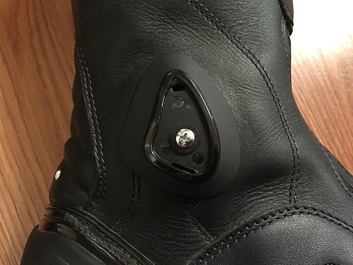 sidi armada boot review, On both sides of the boot beneath the ankle pivot cover on the support system resides the attachment screw Remove both screws and the support brace comes off Replace the empty space of the removed brace with the ankle guard tighten screw and replace cover