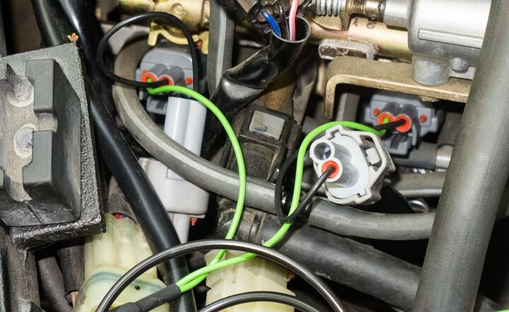 mo tested healtech quick shifter easy, Space may be tight but the QSE harness green and black wires was easily attached to the R6 s injectors