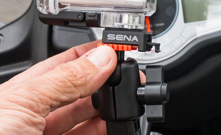 mo tested sena prism camera video, The Prism s Quick Release Mount QRM uses a two stage locking mechanism Slide the shoe into the QRM until it clicks then slide the red latch forward to lock the camera in place