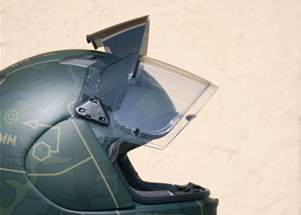 mo tested arai signet q pro tour, In its closed position the sun visor is kept away from the faceshield by a soft rubber guard at the top edge of the visor In the raised position the sun visor locks into position by way of internal bracketry To unlock pull the visor slightly outward then pull down into the closed position