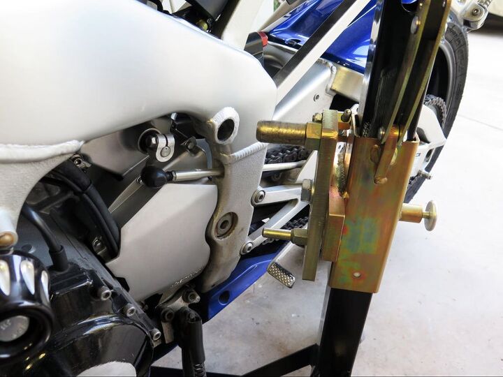 mo tested bursig center lift motorcycle stand, The stand comes with a specific side plate for your model bike but you have to adjust the two pins to fit just right For some bikes you have to remove an engine mounting bolt and replace it with a Bursig one