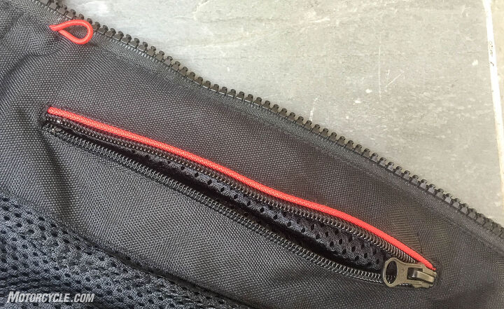 mo tested pilot slate air jacket, The red stripe marks the zippered chest pocket and those who listen to music or directions from their phone will appreciate the cord loop to keep the headphone cable from being eaten by the main zipper