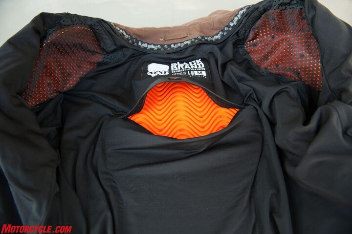 mo tested black brand street team jacket, D3O padding remains pliable under normal conditions and hardens upon impact The orange protectors come standard on the Street Team in the elbows shoulders and back