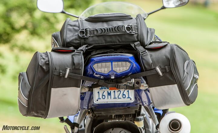 mo tested cortech super 2 0 saddlebags tail bag review, The left side of the bags have been expanded while the right side remains zipped Note the heat shielding on the bottoms of the bags