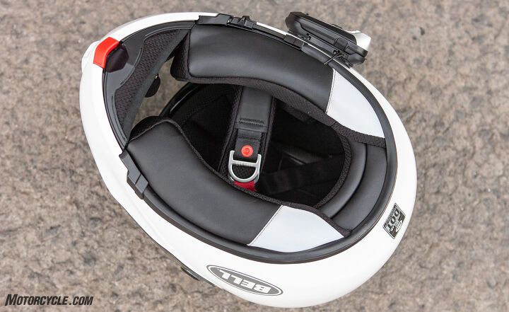 mo tested bell srt m helmet review, The sculpted comfort padding at the base of the helmet provides a good seal from the wind but the chin curtain could be a little larger Note the red chin bar release lever The communicator mounted on the helmet is part of a future product review