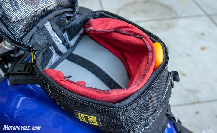 mo tested wolfman blackhawk tank bag review, Despite the odd dimensions forced on the tank bag by adventure bikes tank shape you can get a fair amount of cargo in the Blackhawk The visor for my XL Shoei Hornet X2 fit perfectly and left plenty of room in the center for food and a charging station