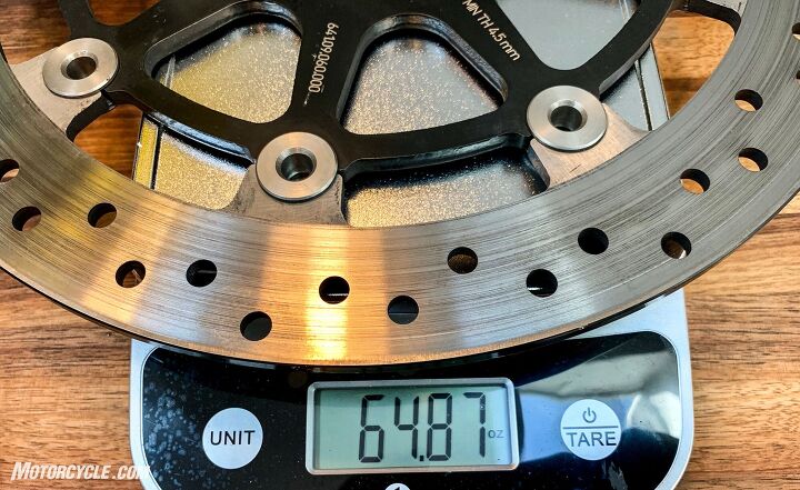 mo tested ktm powerparts wave brake discs, Look at the difference in the stock disc s holes versus the PowerParts one below The disc carrier is also steel instead of aluminum