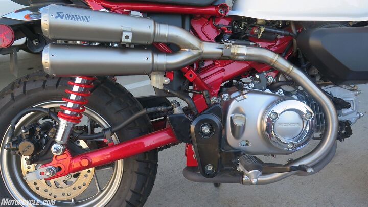 mo tested akrapovic exhausts for honda monkey, Simple enough no East meets West right below the footpeg and the slip on system retains the stock catalyzer under the engine